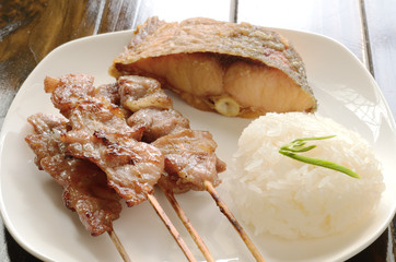 Sticky rice with grilled pork wood stick and fish fried