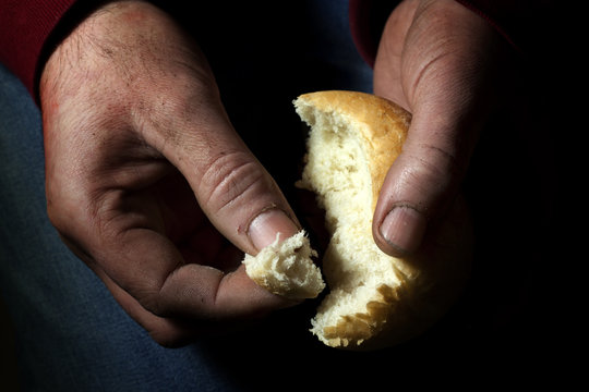 poverty, hands with bread