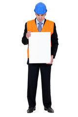Man with helmet holding poster