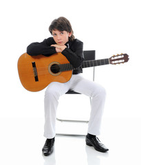 Little boy musician playing guitar