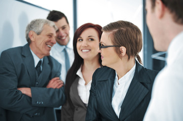 Business team of five discussing a project