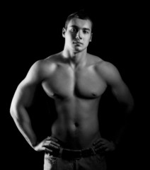 Obraz na płótnie Canvas Bodybuilder showing his muscles