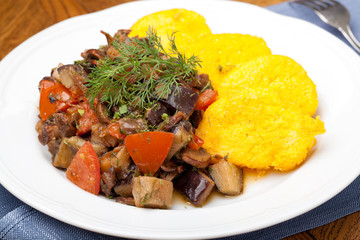 Polenta slices with vegetable stew