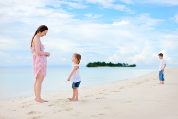Mother and two kids at beach
