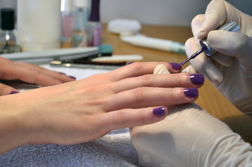 Obraz na płótnie Canvas manicurist nail polish colors purple clients