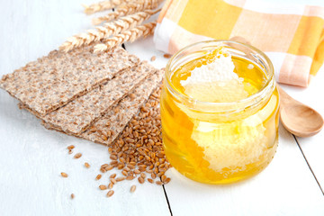 honey with crispbread and wheat grain