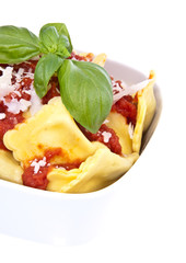 Raviolis with tomato sauce isolated on white