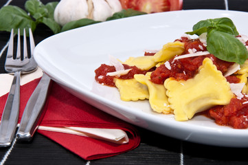 Fresh Raviolis on a plate (with ingredients)