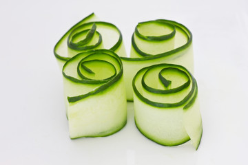 Cucumbers rolls on a white surface