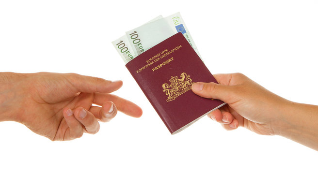 Woman giving passport with money
