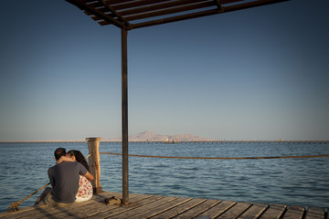 Romantic Couple Jetty Leading Into The Red Sea In Egypt