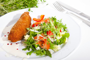 garlic chicken kiev with mixed leaf salad