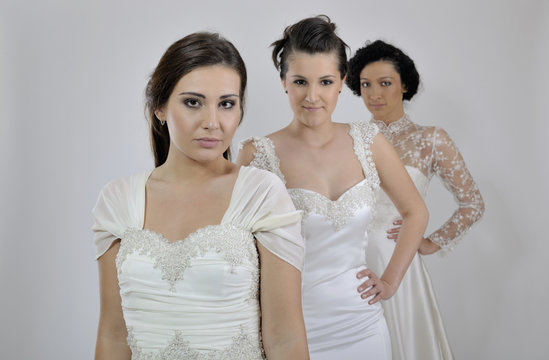 portrait of a three beautiful woman in wedding dress