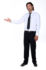 Businessman holding his hand out into open space