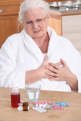 Elderly lady taking her medication