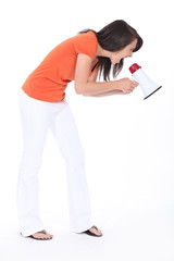 Young woman shouting into a megaphone