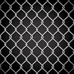 Metal fence on a dark background.
