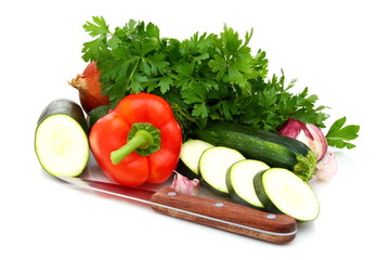 Fresh vegetables, parsley and knife.