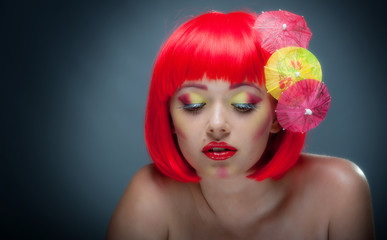 Pretty young girl with colourful makeup