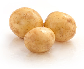 Young potato isolated on white background, closeup