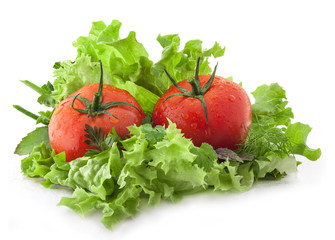 Composition of tomatoes and lettuce on white background