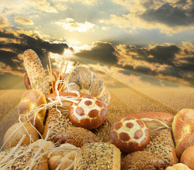 bread and sunset on meadow