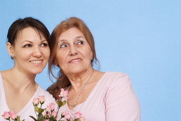 Good Caucasian elderly woman and her daughter