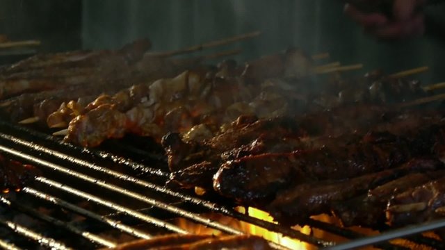 A shashlyk being prepared on a mangal