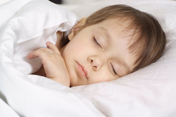 Fototapeta na wymiar A small beautiful baby sleeps