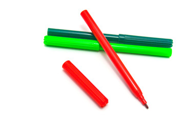 Red and green markers on white
