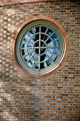 round window in brick wall