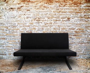 modern sofa in old brick wall room setting