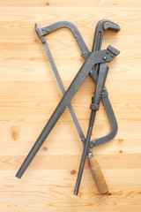 Hacksaw and adjustable spanner