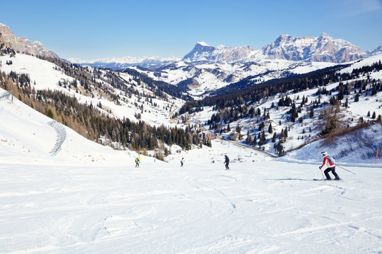 Skiers on a piste