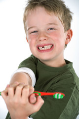 boy demonstrate toothbrush