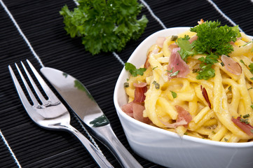 Cheese Spaetzle in a Bowl (on black)