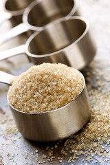 Raw Sugar in Measuring Spoon