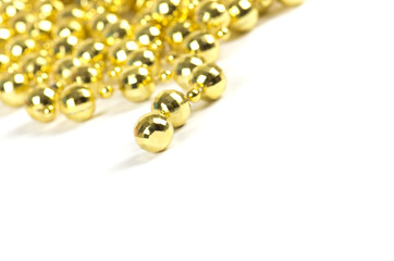 Background made of a brilliant celebratory beads of golden color