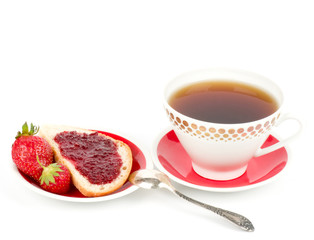Dessert - sweet cake with strawberry and cherry on a plate