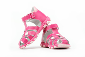 pink child's sandals isolated on white