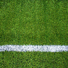White stripe on the green soccer field from top view © 2nix