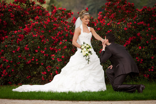 kneeling and proposing for marriage handkiss