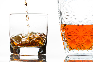 Pouring bourbon next to a decanter