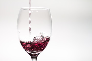 Pouring wine into a wineglass