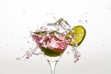 Ice cubes splashing a cocktail