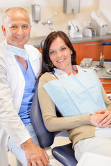 Dentist and female patient at surgery office