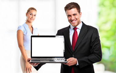 Businessman showing a laptop