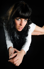 Fototapeta premium Attractive woman lying on black background