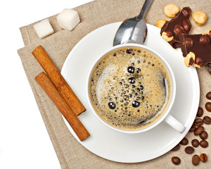 Coffee cup, chocolate, hazelnut, beans, sugar and cinnamon