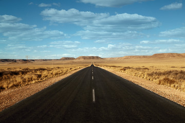 paved road in the desert with clouds Namibia Africa